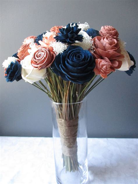 These gorgeous handmade wedding bouquets are made from only high quality flowers that look just as beautiful as the fresh. The Princess-Rose Gold Navy Blue Blush and Ivory Wood ...