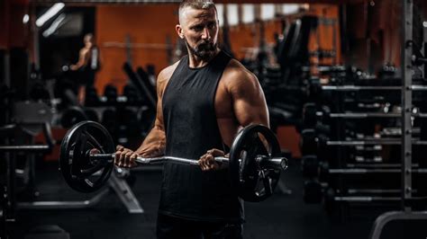 How To Do The Barbell Curl For Bigger Biceps Breaking Muscle