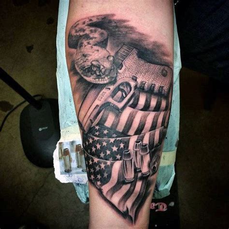 The tattoo consists of an eagle tightly holding two steel rods with its paws which in turn are attached to an american and confederate flag. Pin on Gun Tattoos For Men