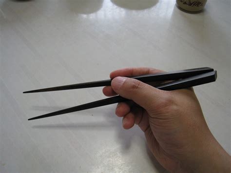 The fork and the spoon are both a part of the thai dining table. How to Hold Hashi Chopsticks, Japan Traveling Etiquette ...