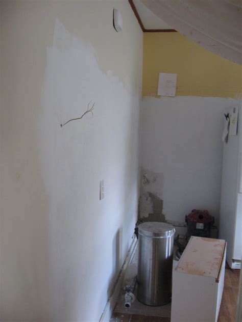 Carefully bend the sheetrock along the scored line. And painted it out to match the exsisting wall colors: