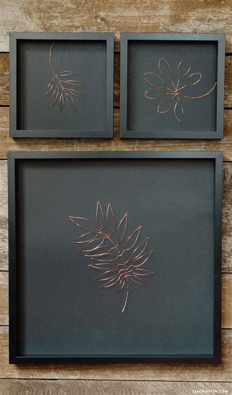 A few like framed paintings and a few like canvas paintings hanging on their walls. Botanical Copper Wall Art - Lia Griffith