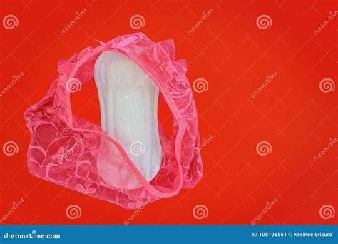 pink women`s lace panties with sanitary napkin on red background stock image image of concept