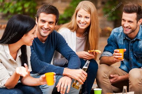 People Talking To Each Other And Drinking ⬇ Stock Photo