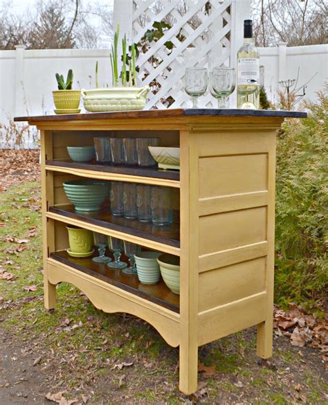 With someone else supporting them, unscrew the cabinets from the wall and remove them. Heir and Space: An Antique Dresser Turned Kitchen Island