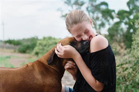 Teen Girl Hugging Her Dog By Stocksy Contributor Gillian Vann Stocksy