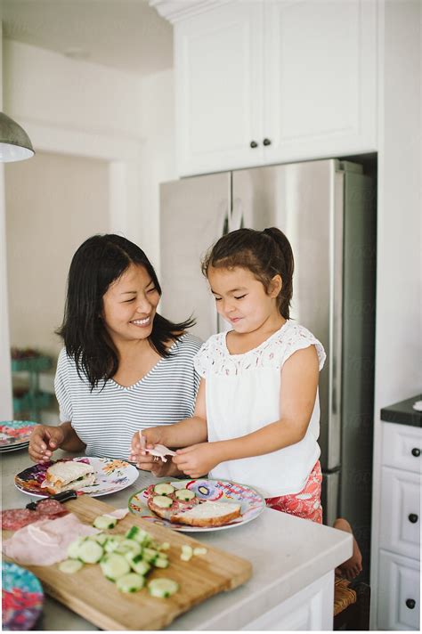 Mom And Daughter Making Lunch Together In Kitchen By Stocksy Contributor Kristin Rogers