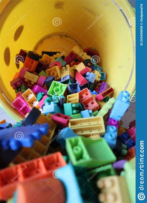 A Bucket Of Scattered Legos On The Floor Stock Photo Image Of Figure