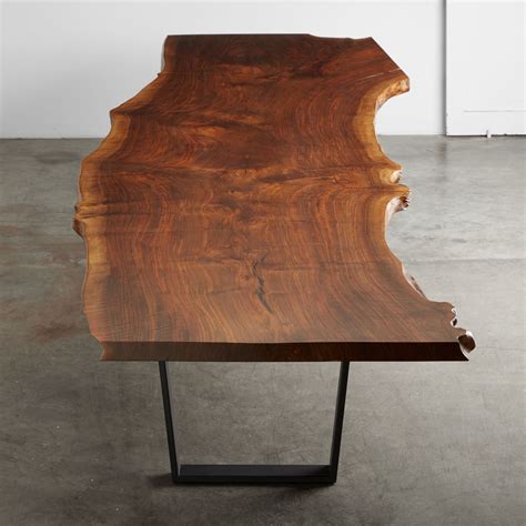 A Walnut 16 Foot Single Slab Tabletop With Natural Edges Is Shown With