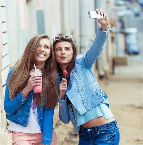 Hipster Girlfriends Taking A Selfie In Urban City Stock Image Image