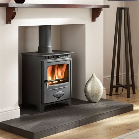 We recently installed a wood stove in our home and had no issues with the installation process. Dark hearth | Wood burning stove, Home, Stove decor