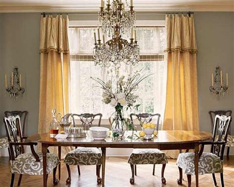 Chic contemporary dining room features a suzanne kasler morris lantern hung from a peacock blue vaulted ceiling between skylights and over a black and gold dining table surrounded by gold and. Grey And Gold Dining Room Ideas, Pictures, Remodel and Decor