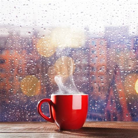 Steaming Cup Of Coffee Over A Cityscape Stock Image Colourbox