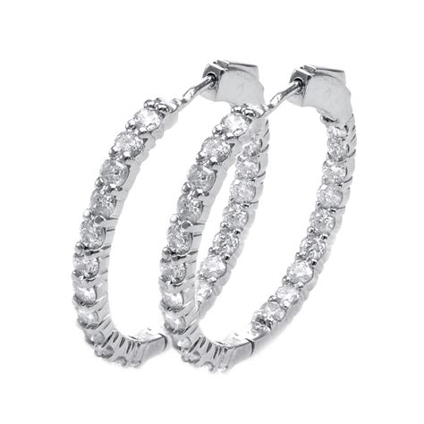 Crafted in 14k white gold, each earring features a mesmerizing 1 ct. 14K White Gold Brilliant Inside Out Round Diamond Hoop ...