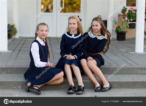 Schoolgirls In School Uniform Rest On A Break Near The School — Stock