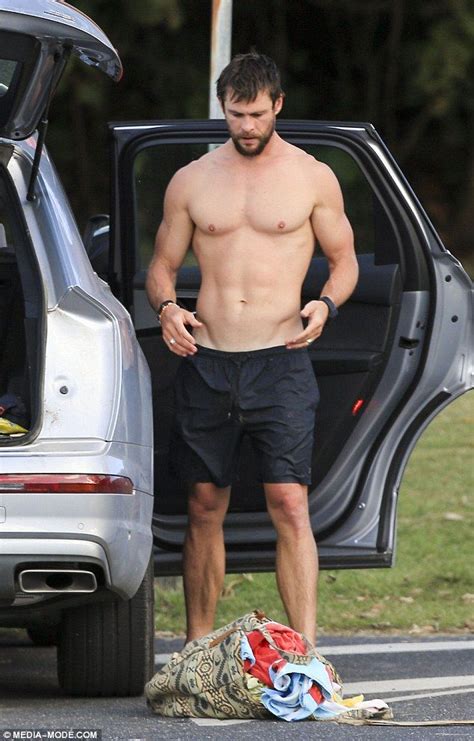 Chris Hemsworth Shows Off His Buff Body Getting Changed At The Beach