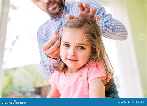 hipster father with his daughter styling her hair indoors stock image image of offspring