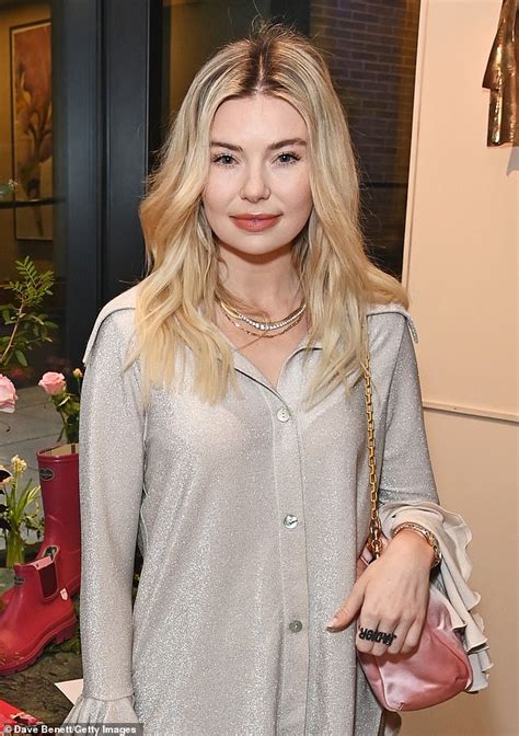 Georgia Toffolo Dons A Dazzling Silver Blouse And Flared Trousers At