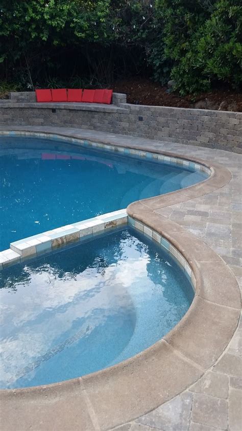 Looking for the best inflatable pool for your kids and family? Paver Pool Deck and Spa. Retaining wall and Love seat ...