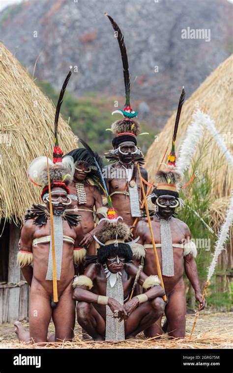 indonesia papua city of wamena group of dani tribe warriors armed with spears and posing in