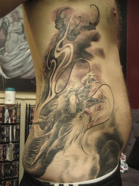 Rib tattoos can display any kind of design, ranging from a portrait to text or any other image that the wearer finds inspiring. Rib Tattoos for Men - Ideas and Inspiration for Guys
