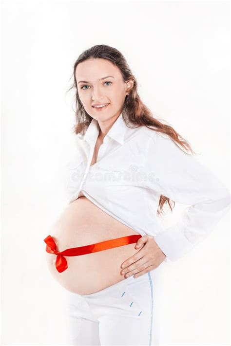 Pregnant Woman With Red Ribbon Tied On The Stomach Stock Photo Image