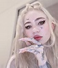Grimes Unveils Gnarly Full Back Tattoo