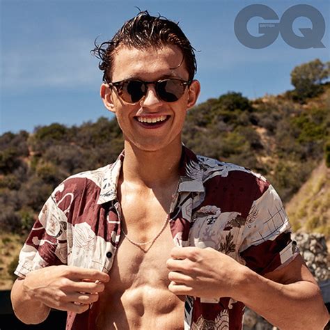 tom holland flashes his six pack abs in british gq e online