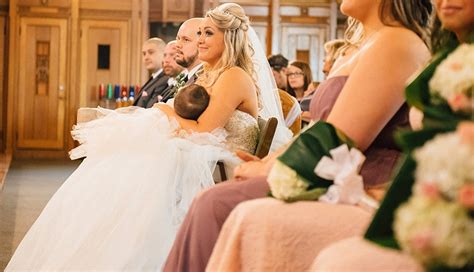 This Photo Of A Bride Breastfeeding During Her Wedding Ceremony Is