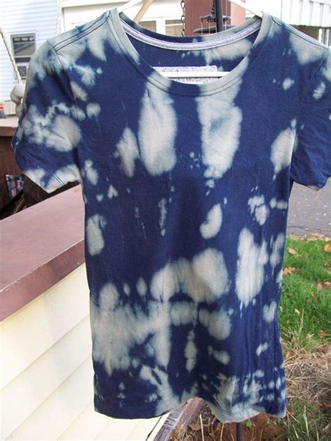 A Blue And White Tie Dyed T Shirt Hanging On A Clothes Line In