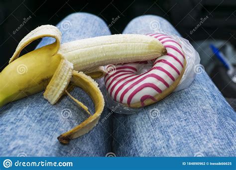 Sweet Doughnut And Peeled Banana Concept Of Sex And Eroticism Stock