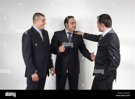 3 Three Business Men In Suits Talking Stock Photo Alamy