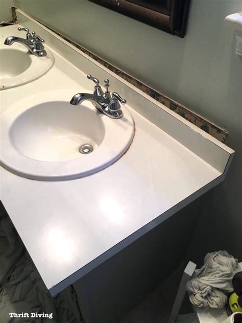 Remove the vanity cabinet check inside the cabinet to determine where it is attached to the wall; How to Remove an Old Bathroom Vanity - Thrift Diving Blog