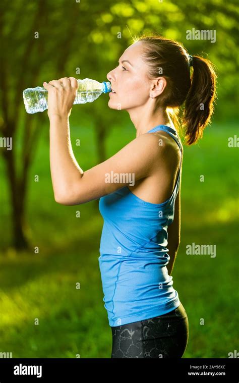 Brunette Woman Drinking Water Hi Res Stock Photography And Images Alamy