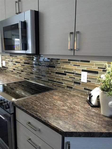 You can still create a cohesive look even if you don't use the same color and stain for the cabinets and the floor. Backsplash and countertop don't match