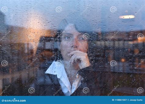 Woman Looking Out The Window On A Rainy Day Stock Image Image Of