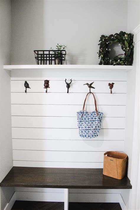 Mudroom Storage Bench With White Shiplap And Animal Hooks Shiplap