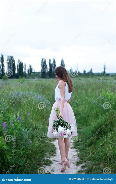 Beautiful Girl Holding A Bouquet Of Pink Peonies Flowers Back View Girl With Flowers Stock