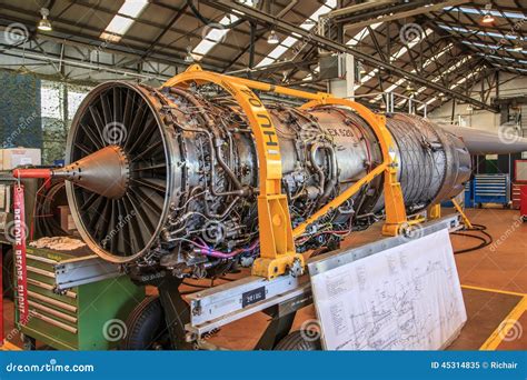 The Exposed Engine Of A Powerful Blue Dragster Racing Car Glinting In