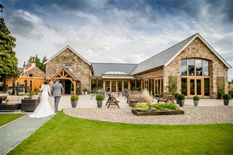 Barn wedding venues are magical at any time of year. 13 beautiful barn wedding venues in the UK