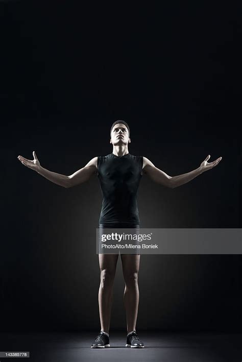 Male Athlete With Arms Outstretched Portrait High Res Stock Photo