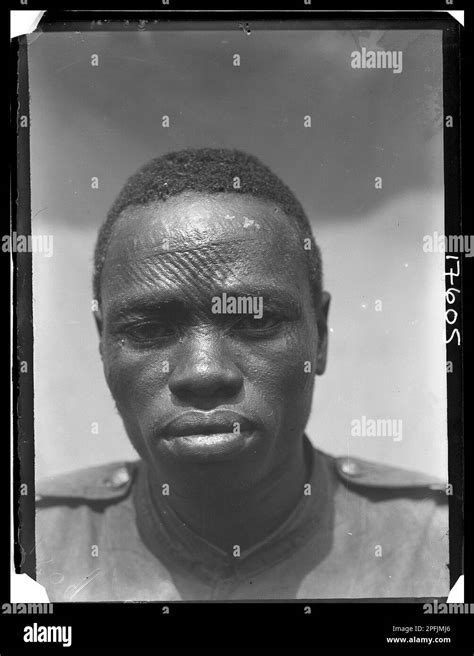 Head And Shoulders Portrait Of A Man With Scarification Of Forehead And