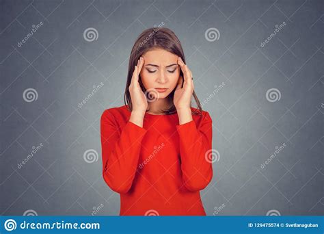 Stressed Out Young Woman With Worried Face Looking Down Stock Photo