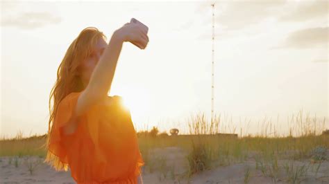 Beautiful Girl Takes Selfie On Beach Using Mobile Phone Cheerful Young