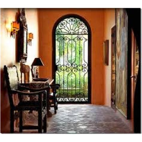 Foyer With Black Iron Gate Spanish Style House Like This