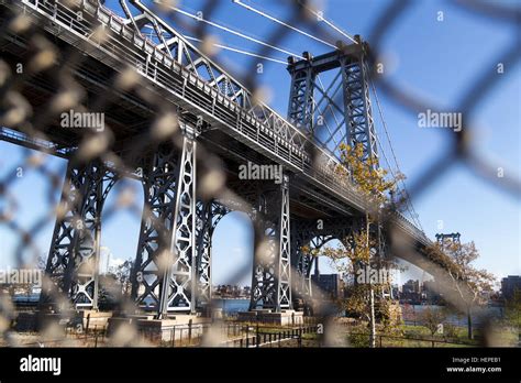 Abstract View Through Fence Of Williamsburg Bridge Towards Brooklyn In