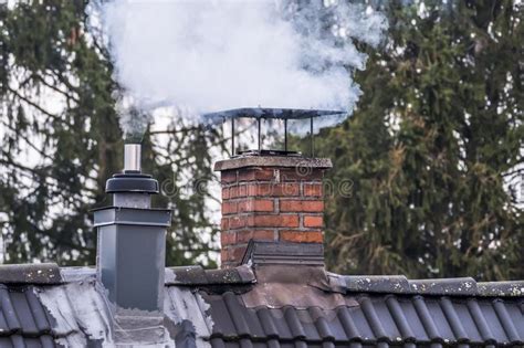 Smoking Chimney And Pipe On The Top Of A House Stock Image Image Of