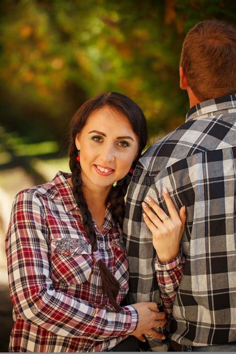 Wife Hugging Her Husband A Man Stands With His Back Stock Photo
