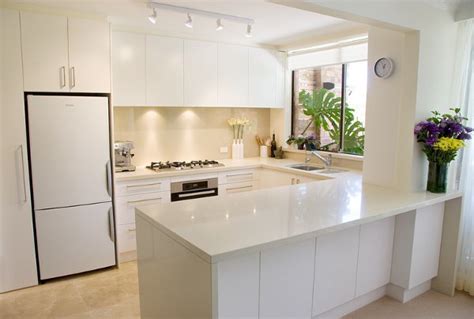 Go all white for your small kitchen with a bunch of cutting boards and simple and stylish, this kitchen designed by bhdm with gray and white paints, give the room a little sophistication. 6 Contemporary Kitchen Designs For Small Spaces| Designer ...