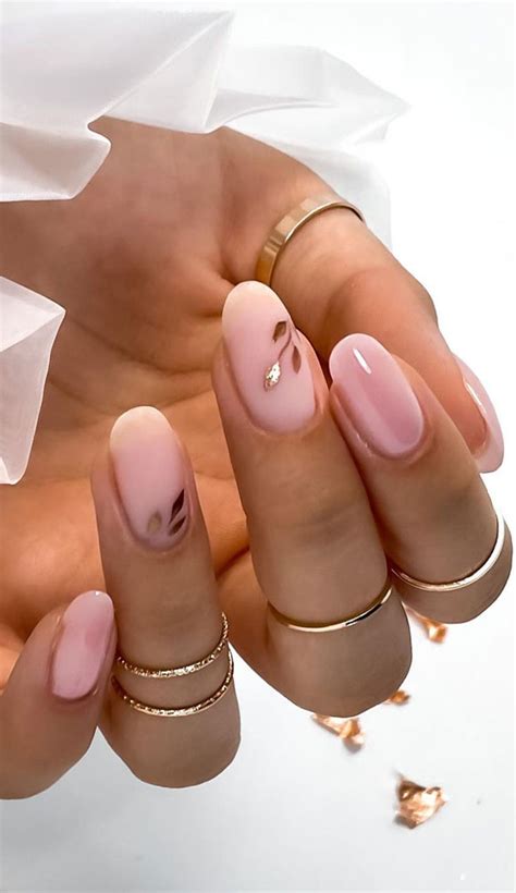 25 beautiful neutral nails to welcome 2023 gold leaf matte nude pink nails